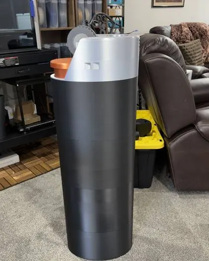 The 4 ft 3D printed lighter replica standing in a living room