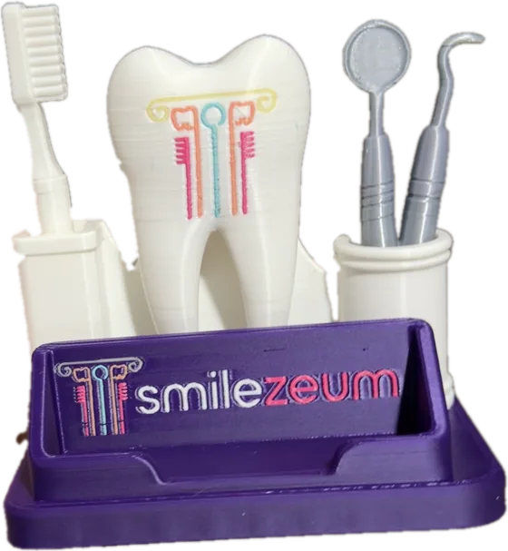 A custom 3D printed purple business card holder with a white tooth, a toothbrush and dental tools and a smilezeum logo