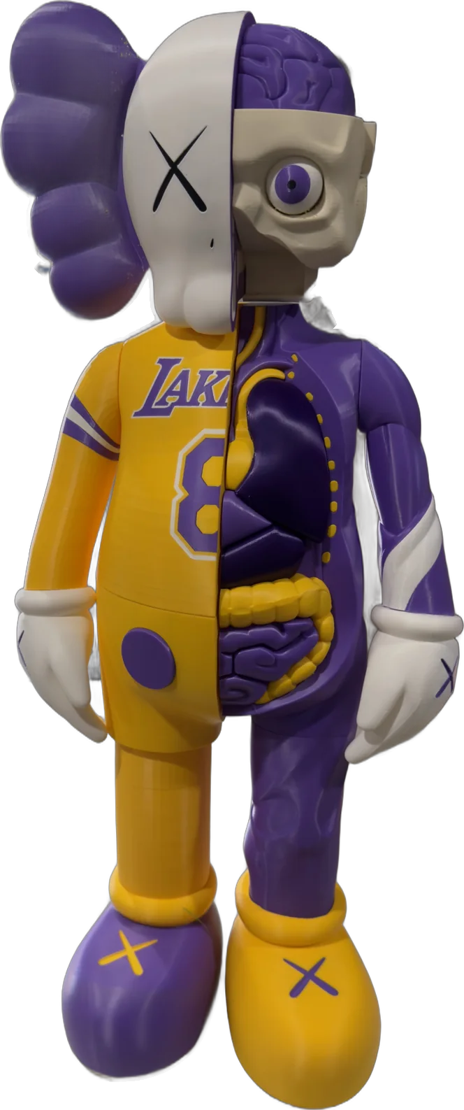 A 3D printed KAWS-style figure in a Lakers purple and gold jersey